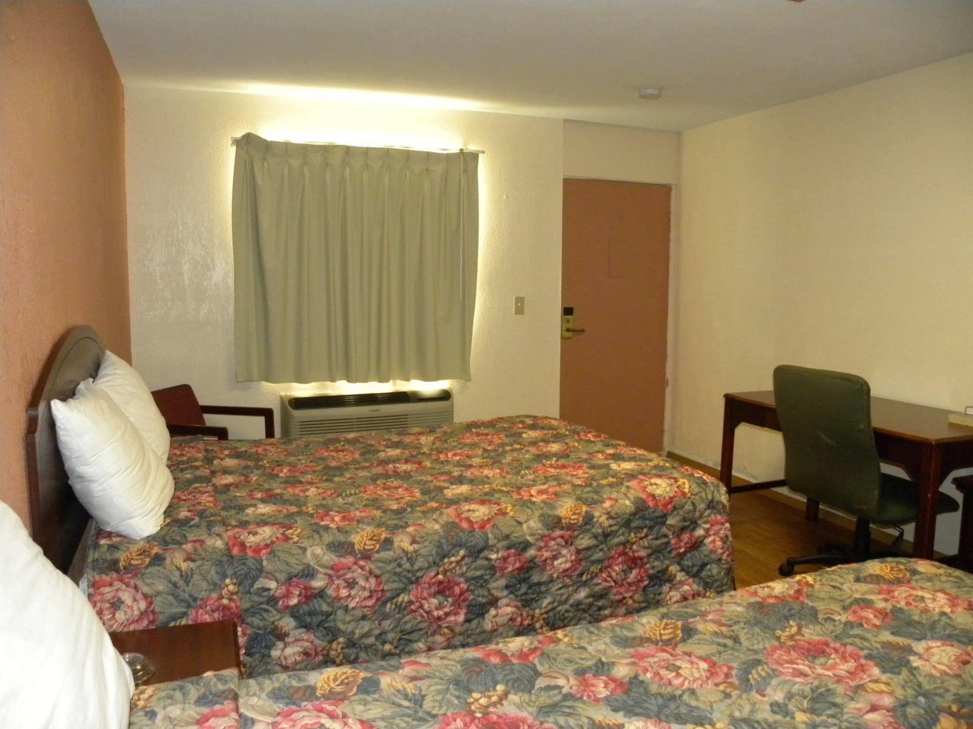 Guest Inn โรเจอร์ส ภายนอก รูปภาพ